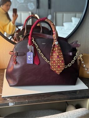 Coach Empire 48 merlot!